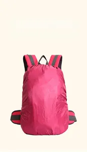 Outdoor hiking backpack with red rain cover for waterproof protection during travel.