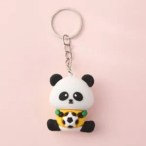 Close-up detail of cute cartoon panda keychain showing dimensions 4.4cm height and 3.3cm width.