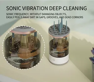 Detail view of ultrasonic makeup brush cleaner showing sonic cleaning action in water