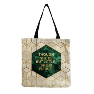 Detailed front view of a stylish tote bag with geometric gold patterns and a quote.