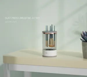 Desktop makeup brush cleaner and dustproof organizer shown with brushes on a desk