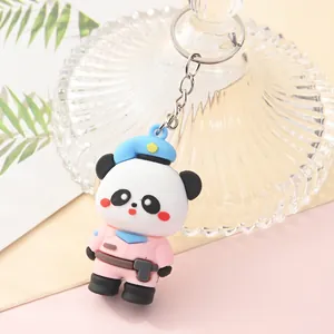 Close-up of a cartoon panda keychain in a pink police uniform outfit