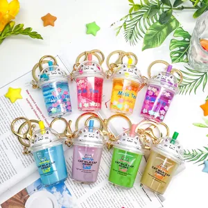 Assorted cute cat milk tea cup keychains with colorful liquid and glitter charms