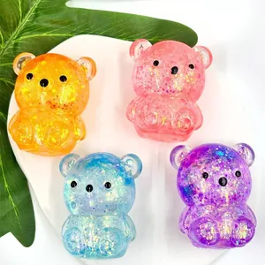 Detailed view of colorful glitter-filled maltose bear squishy toys for stress relief