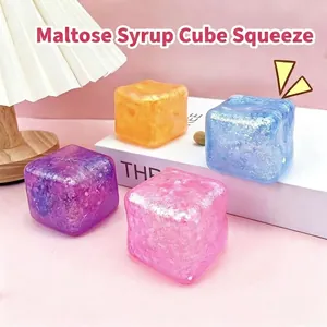 Set of four colorful glitter maltose cube squishy toys for stress relief and decompression