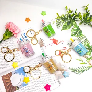 Liquid-filled cute cat milk tea cup keychain in four colors for cute bag pendant