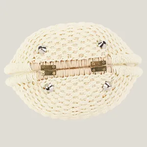 Fashionable cream woven shell handbag with textured paper rope craft and metal base feet