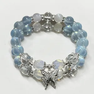 Elegant double-strand light blue beaded bracelet featuring a sparkling butterfly charm