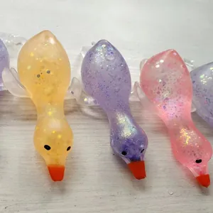 Macro view of colorful glittery goose-shaped maltose squishy toys for stress relief