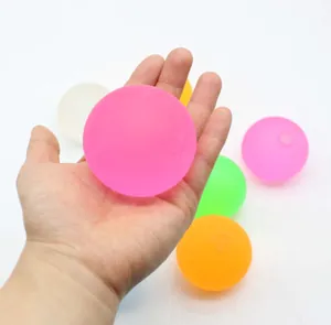Detailed macro shot of colorful maltose stress relief squishy balls held in an open hand