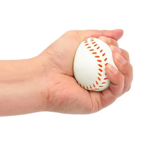 Hand squeezing a soft white foam mini baseball stress relief toy for relaxation