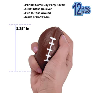 Mini brown foam football stress ball being squeezed by hand showing 3.25 inch size detail