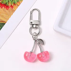 Cute glittery pink cherry keychain with silver metal clip for bags and accessories
