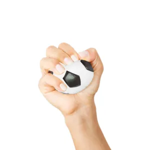Detailed view of a hand squeezing a mini foam soccer ball for effective stress relief