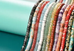 Close-up detail of colorful 2x4mm cylinder stone beads for DIY jewelry making