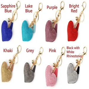 Heart-shaped rhinestone keychains in eight colors with decorative tassels.