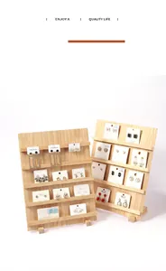 Detailed macro view of a tiered natural wood display stand for jewelry and nail art