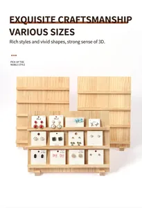 Macro detail of tiered wooden display stand for jewelry and press-on nails on cards