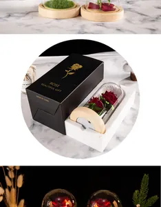 Gift box packaging detail of artificial rose in LED glass dome for romantic occasions