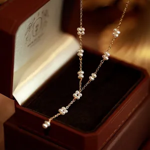 Handmade freshwater pearl necklace with flower clusters and tassel in an elegant box