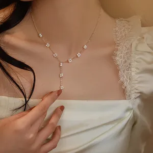 Elegant handmade woven flower freshwater pearl necklace with gold tassel pendant for women