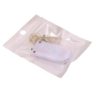 Close-up detail of a mini LED fairy light string with battery box in a clear bag