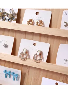 Multi-tier tiered wooden display stand for jewelry and press-on nails, macro detail view