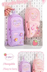 Detailed view of portable schoolbag style pencil cases hanging on a pegboard.