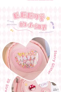 Detail of pink heart-shaped pencil bag with glitter and cute character charm