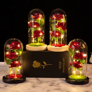 Elegant artificial red rose in glass dome with LED string lights for Valentine's Day gift decor