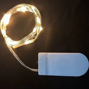 Warm white LED copper wire fairy lights with white battery box on black background