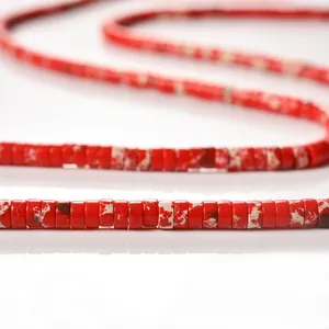 Close-up of 2x4mm red marbled cylinder tube spacer beads for DIY jewelry making.