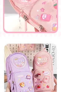 Close-up of cute backpack pencil case showing waterproof fabric and decorative charms.