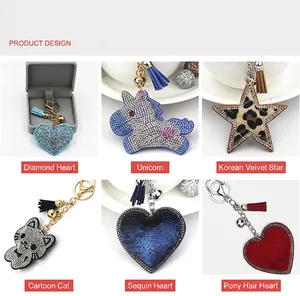 Detailed showcase of various rhinestone heart and animal shaped keychains with tassels