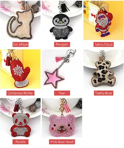 Collage of various rhinestone-studded keychains featuring cat, penguin, and bear shapes