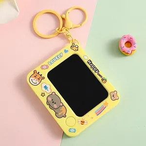 Yellow mini doodle drawing board keychain featuring cute cartoon animal patterns and screen