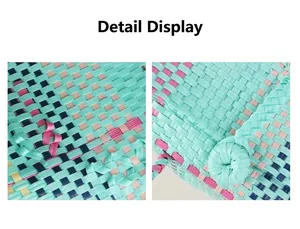 Close-up of colorful hand-woven plastic basket bag showing fine texture and knots.