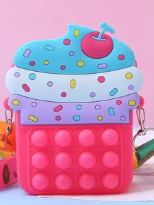 Cute cupcake shaped silicone crossbody bag for kids featuring a pop-it fidget toy design