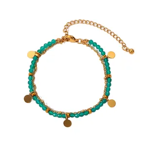 Elegant 18k gold plated stainless steel bracelet with green natural stone beads and charms.