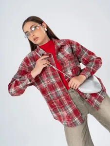 Fashion detail of retro red checkered long shirt for women with a vintage texture finish