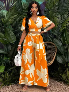 Orange and white tropical print butterfly sleeve crop top and wide-leg trousers set