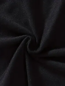 Macro view showing the soft texture and knit weave of the premium black cotton fabric.
