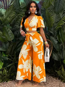 Fashionable tropical print two-piece set with butterfly sleeve crop top and wide-leg pants