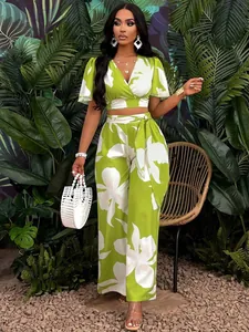 Two-piece tropical floral print set with butterfly sleeve top and wide-leg pants