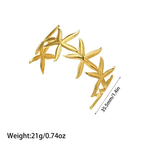 Detailed view of gold starfish open cuff bracelet with weight and size specs