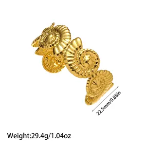 Detailed view of a minimalist gold titanium steel open bangle with shell spiral design