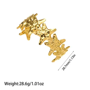 Detailed macro view of gold textured starfish open cuff bracelet showing weight specs