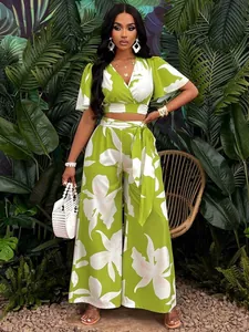 Tropical print two-piece set featuring butterfly sleeves and wide-leg pants.