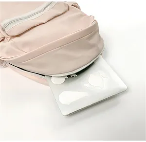 Large capacity pink student backpack showing a laptop inside the main compartment