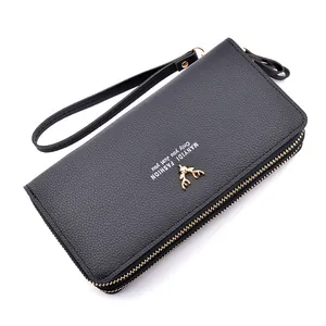 Black women's long double-zipper wallet with gold deer ornament and wrist strap